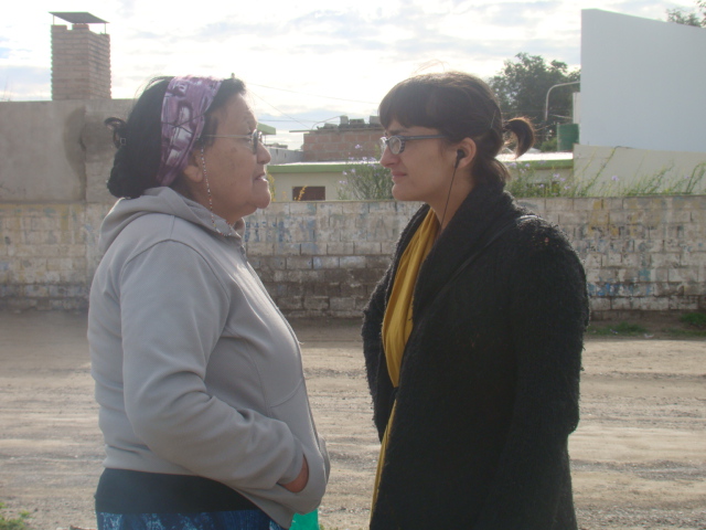 A woman tells her personal story to the journalist